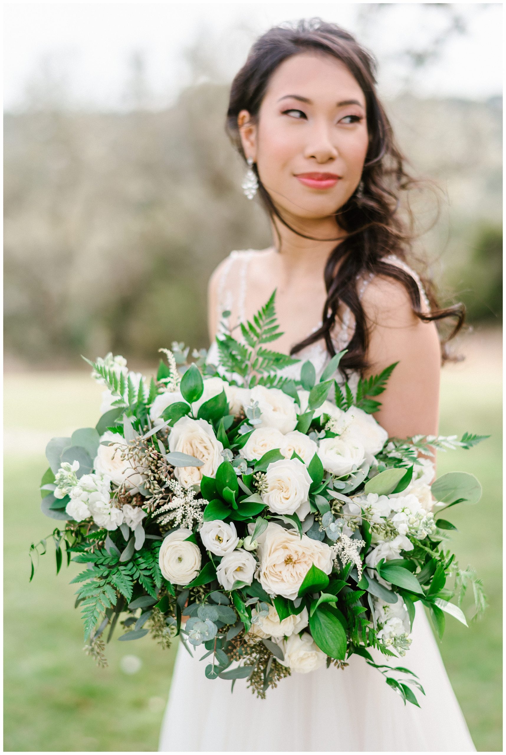 Gorgeous Bride holding her Classic White Bouquet