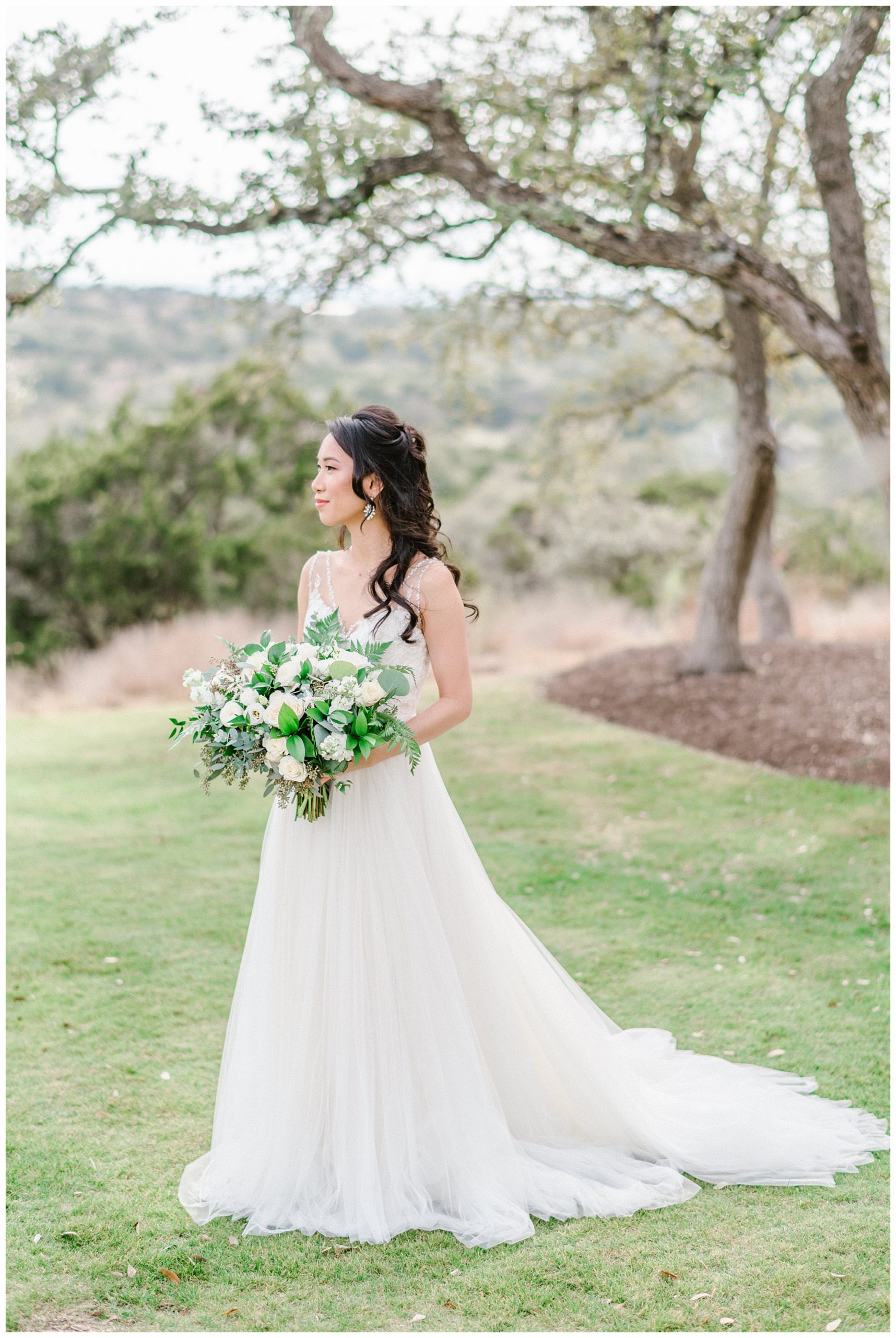 Gorgeous Bride holding her Classic White Bouquet