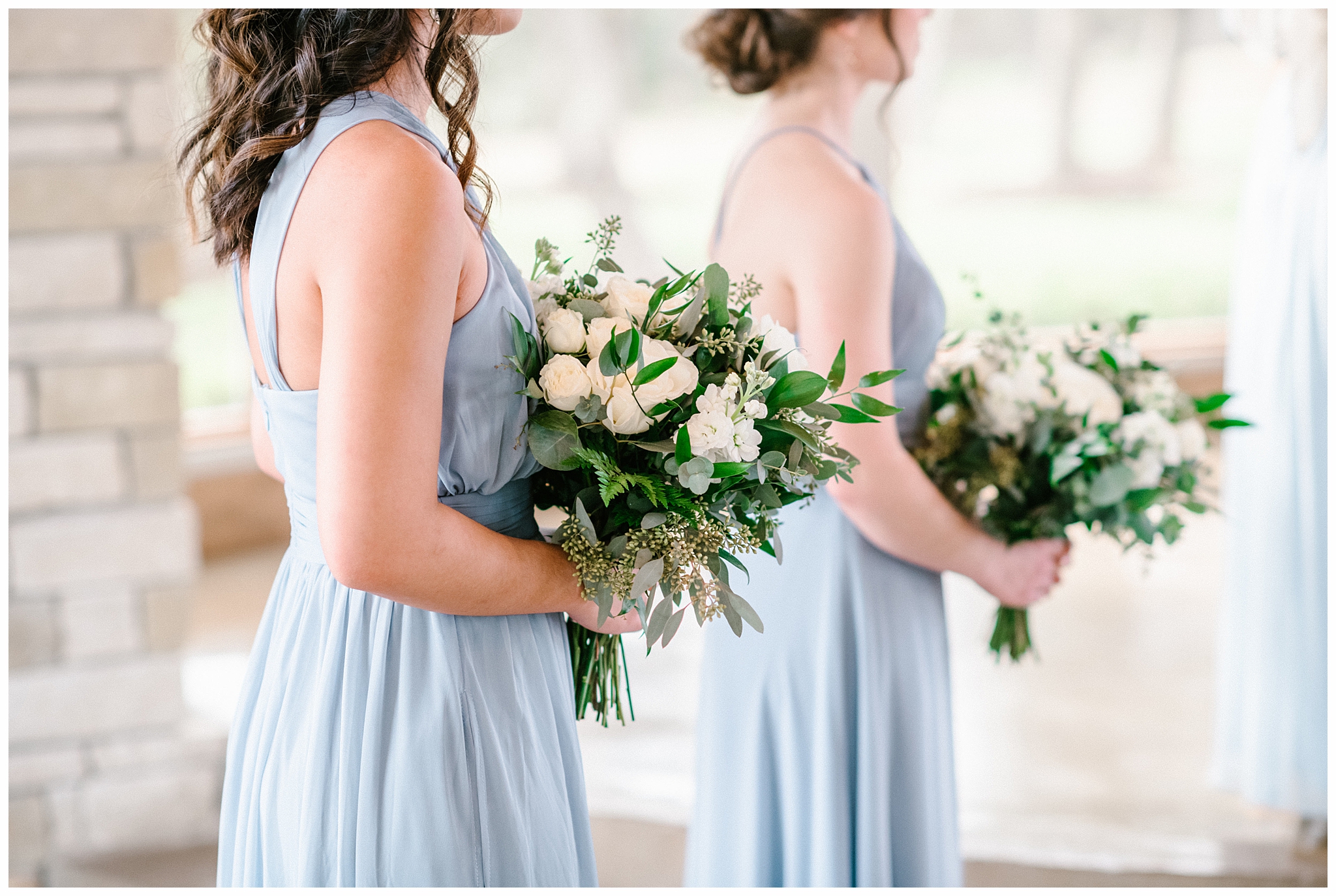 Bridesmaids holding their Classic white Bouquets