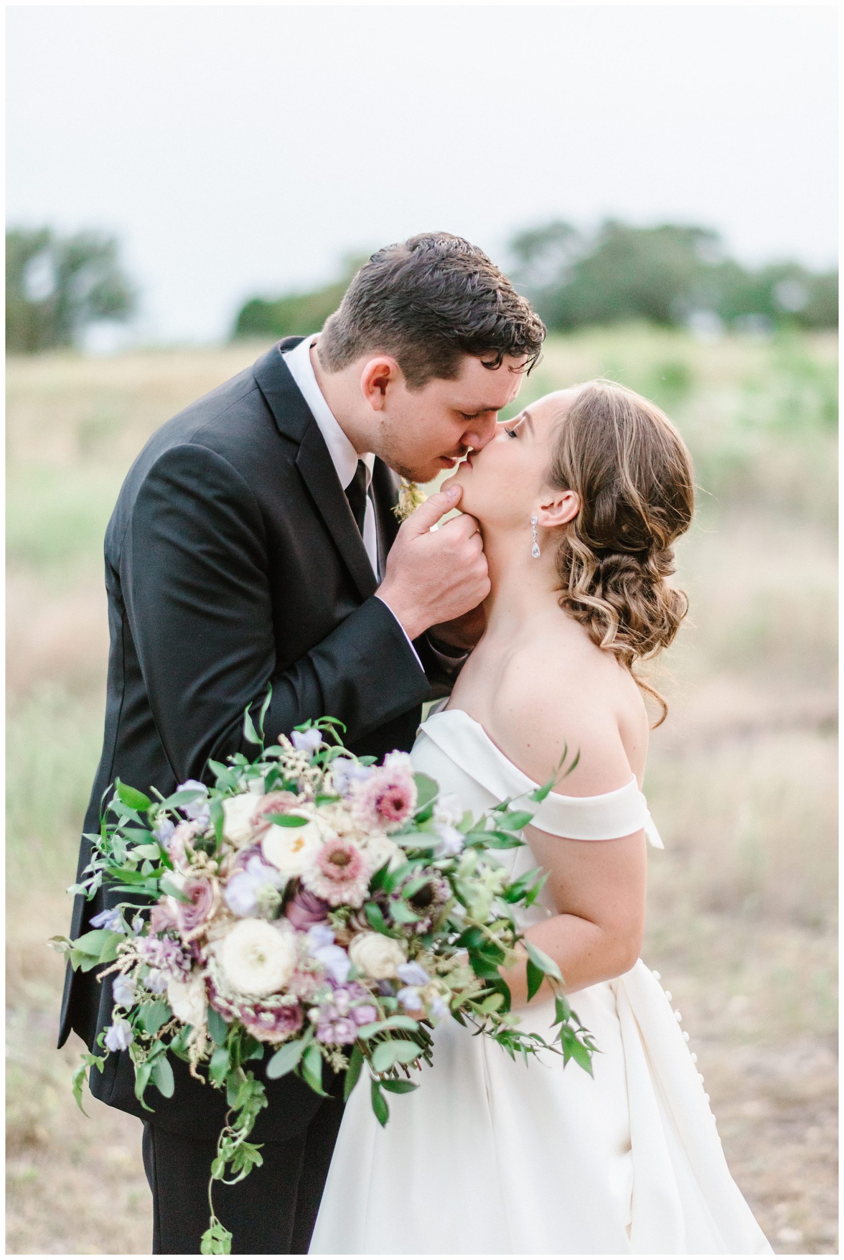 Bride and Groom Portrait with Beautiful Violet and Plum Bridal Bouquet