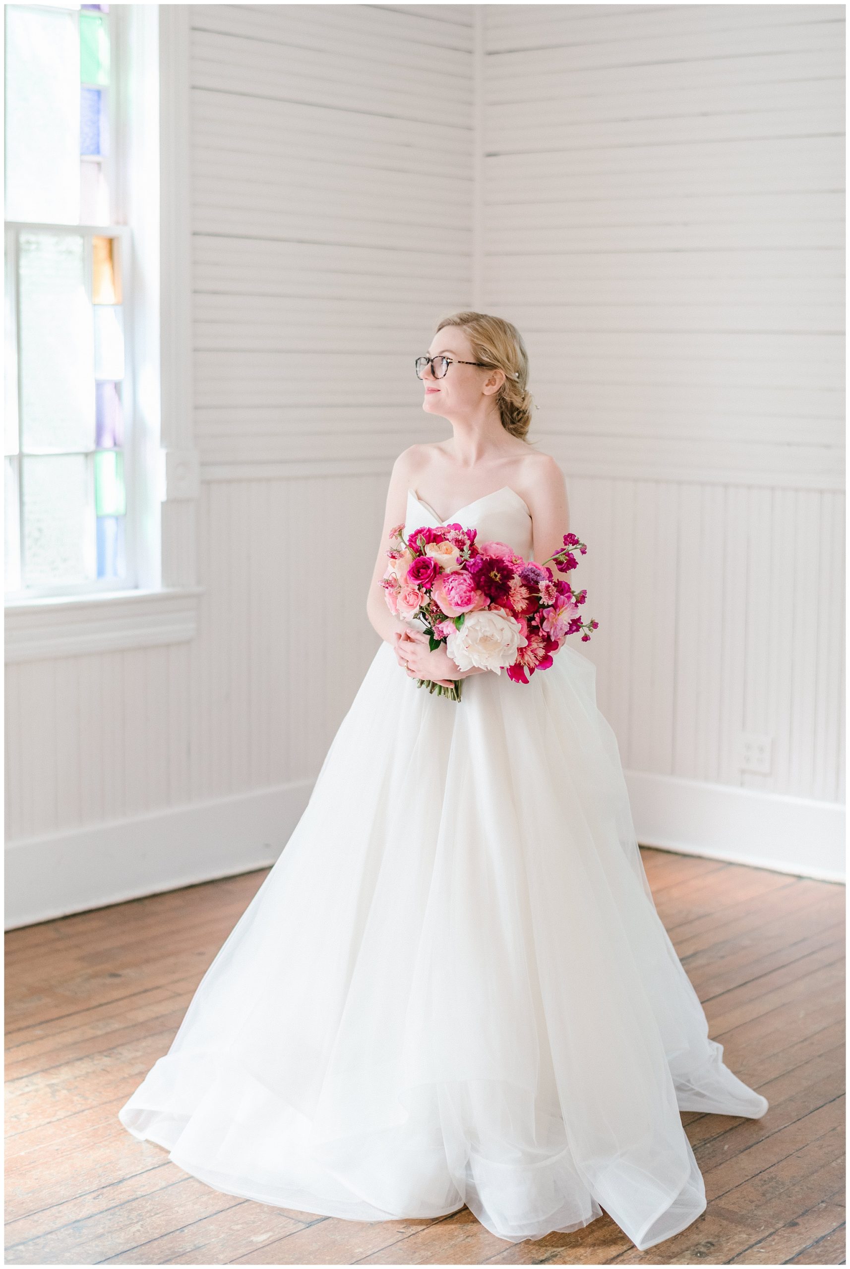 beautiful bride with fuchsia rose and blush florals