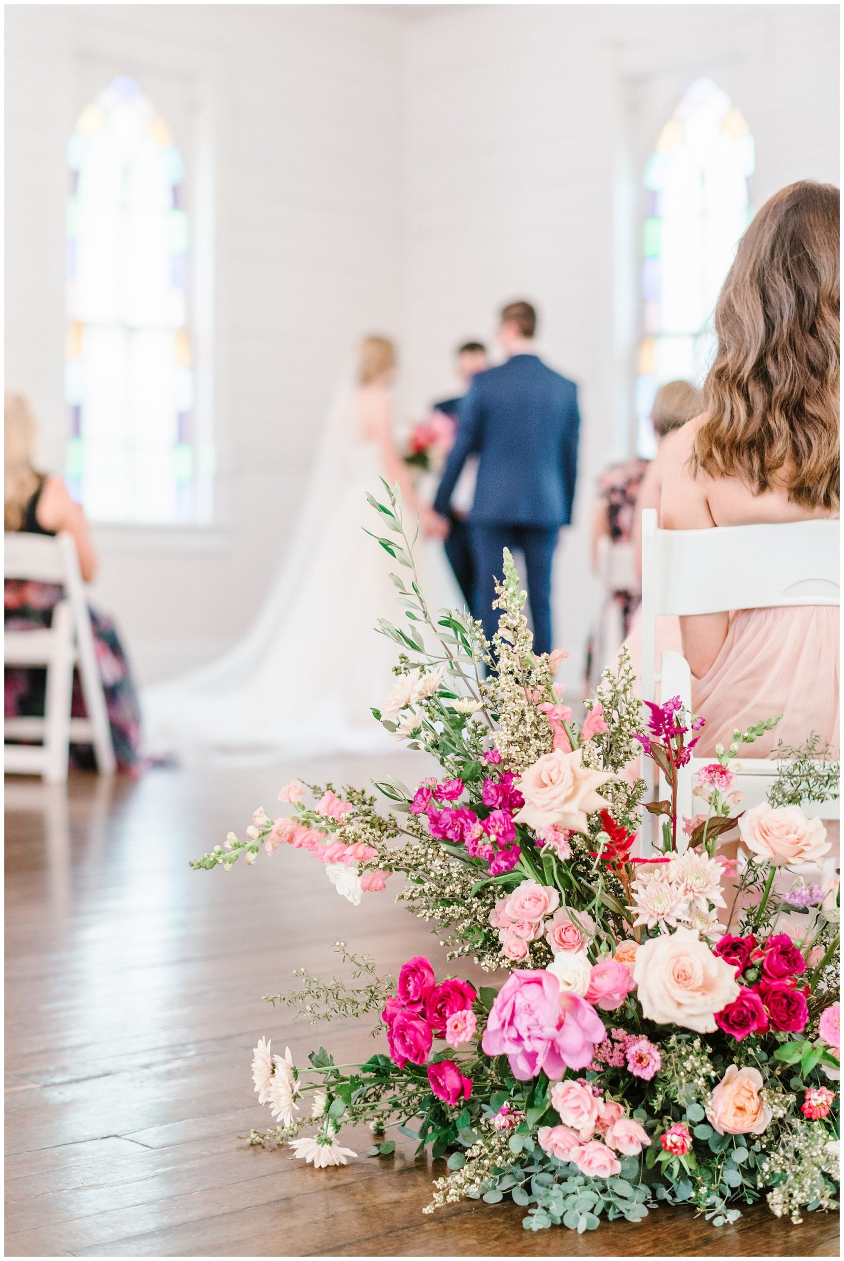mercury hall intimate wedding ceremony with beautiful couple and bright florals